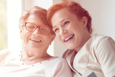 smiling elderly woman with a middle aged woman