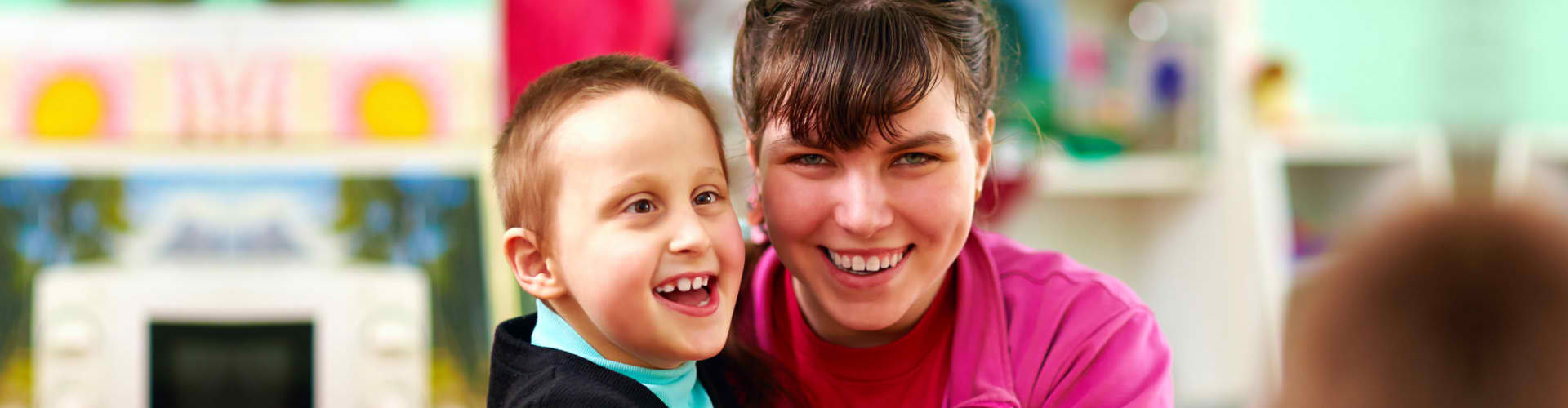 boy with disabilities together with a woman